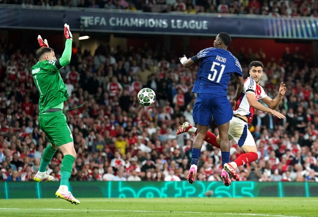 Arsenal’s Mikel Merino, right, heads past Paris Saint Germain goalkeeper Gianluigi Donnarumma only for the goal to be disallowed by VAR