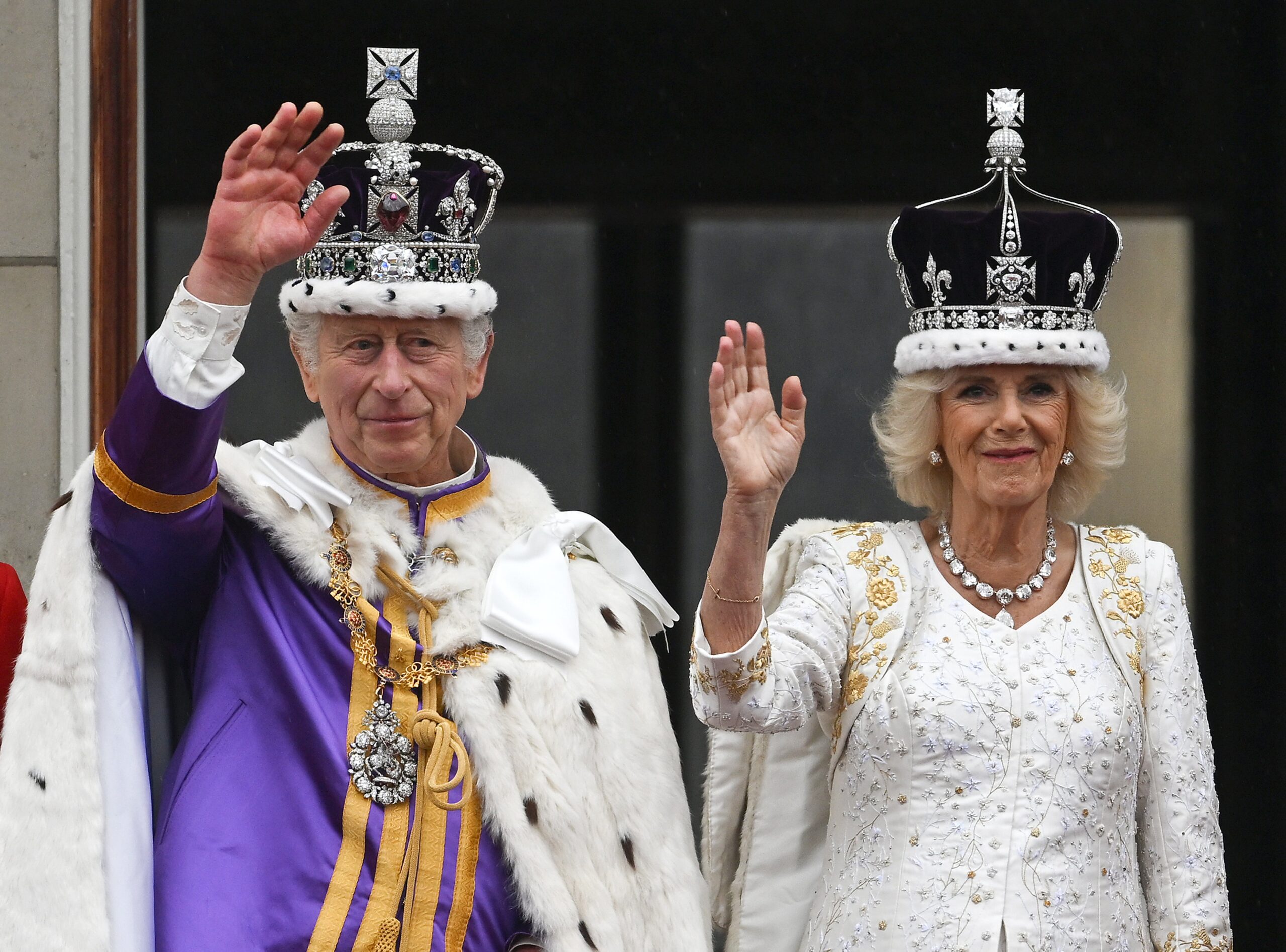 King Charles III and Queen Camilla wave from the Buckingham Palace balcony during the Coronation of King Charles III and Queen Camilla on 6 May 2023