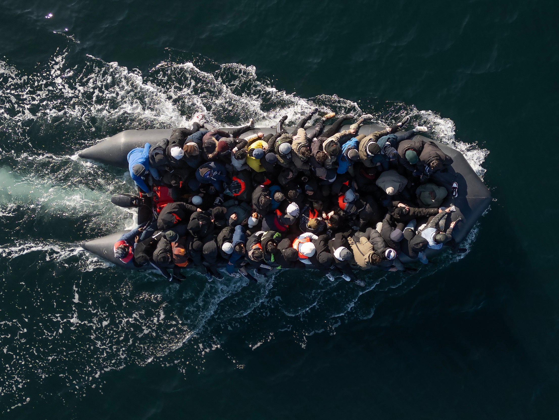 An inflatable dinghy carrying around 65 migrants crosses the English Channel on March 06, 2024 in the English Channel.