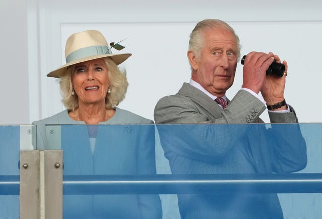 The King and Queen watching their horse Desert Hero at the St Leger