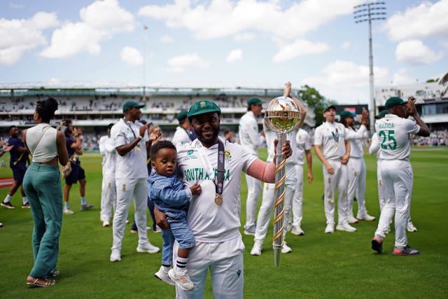 South Africa captain Temba Bavuma, holding his child, parades the World Test Championship mace around Lord's