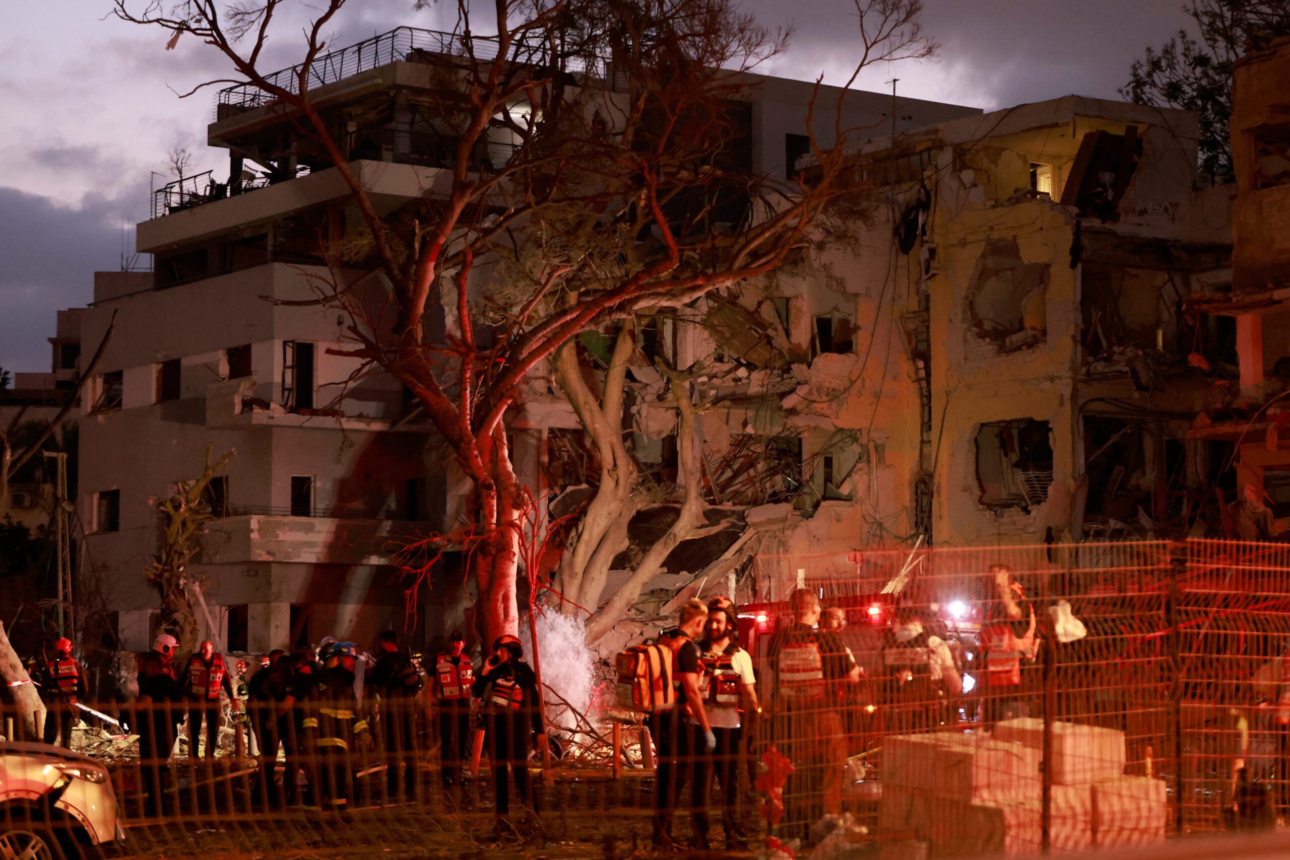 Rescuers work near damaged building in the Israeli city of Tel Aviv following an Iranian missile attack
