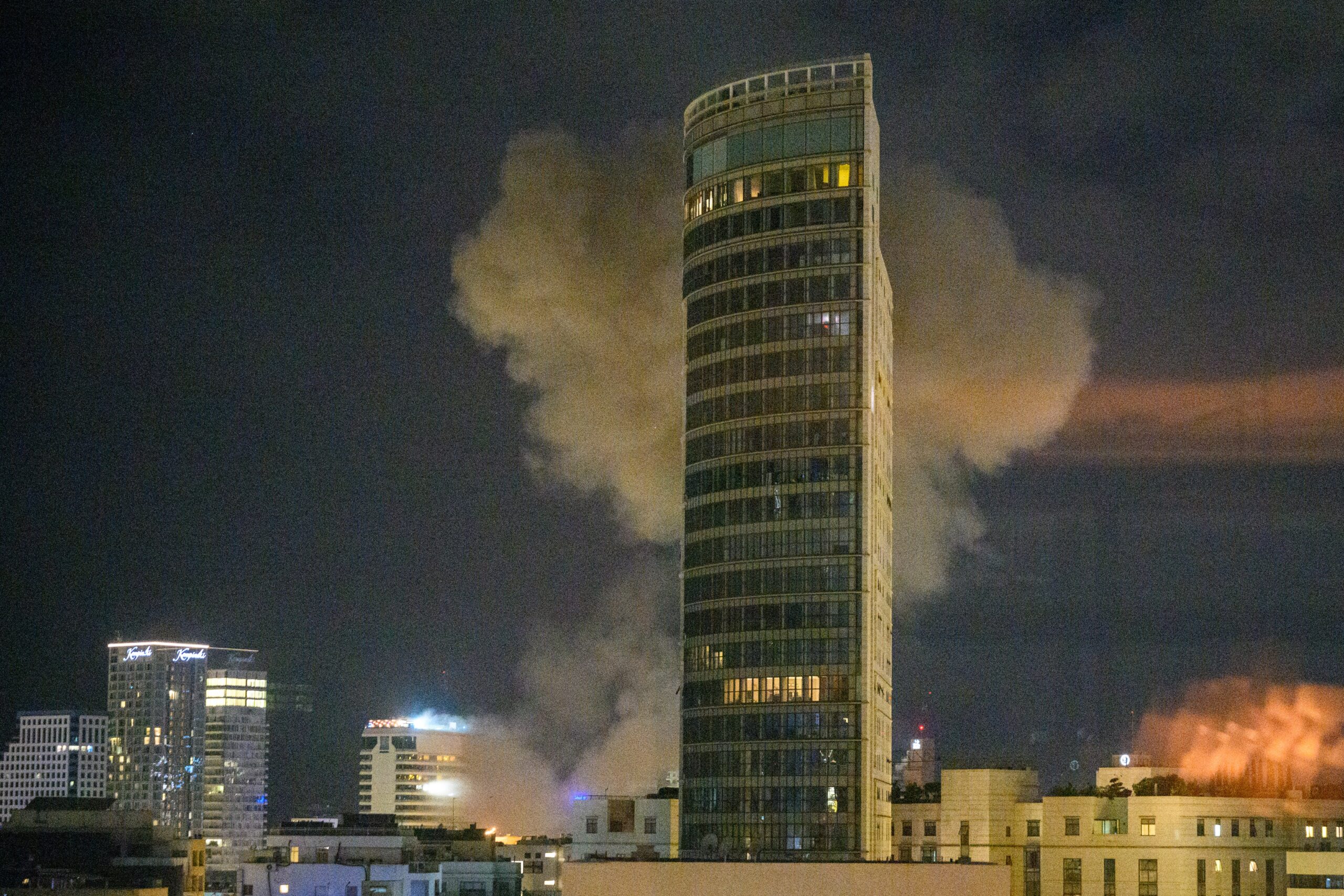 Smoke rises after an Iranian rocket strike in Tel Aviv, Israel