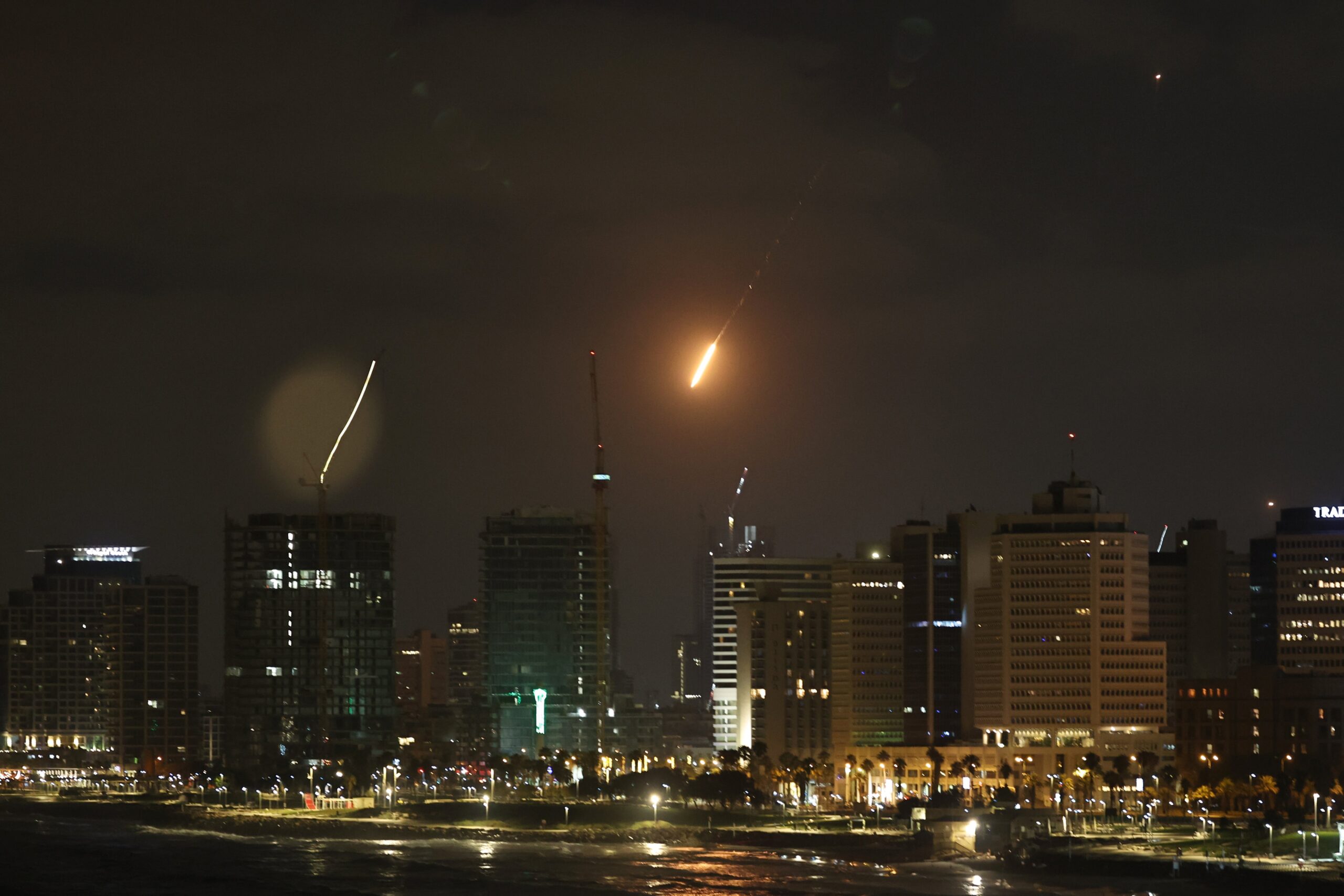 A missile fired from Iran breaches Israeli's 'Iron Dome' air defence system as it strikes an area in Tel Aviv