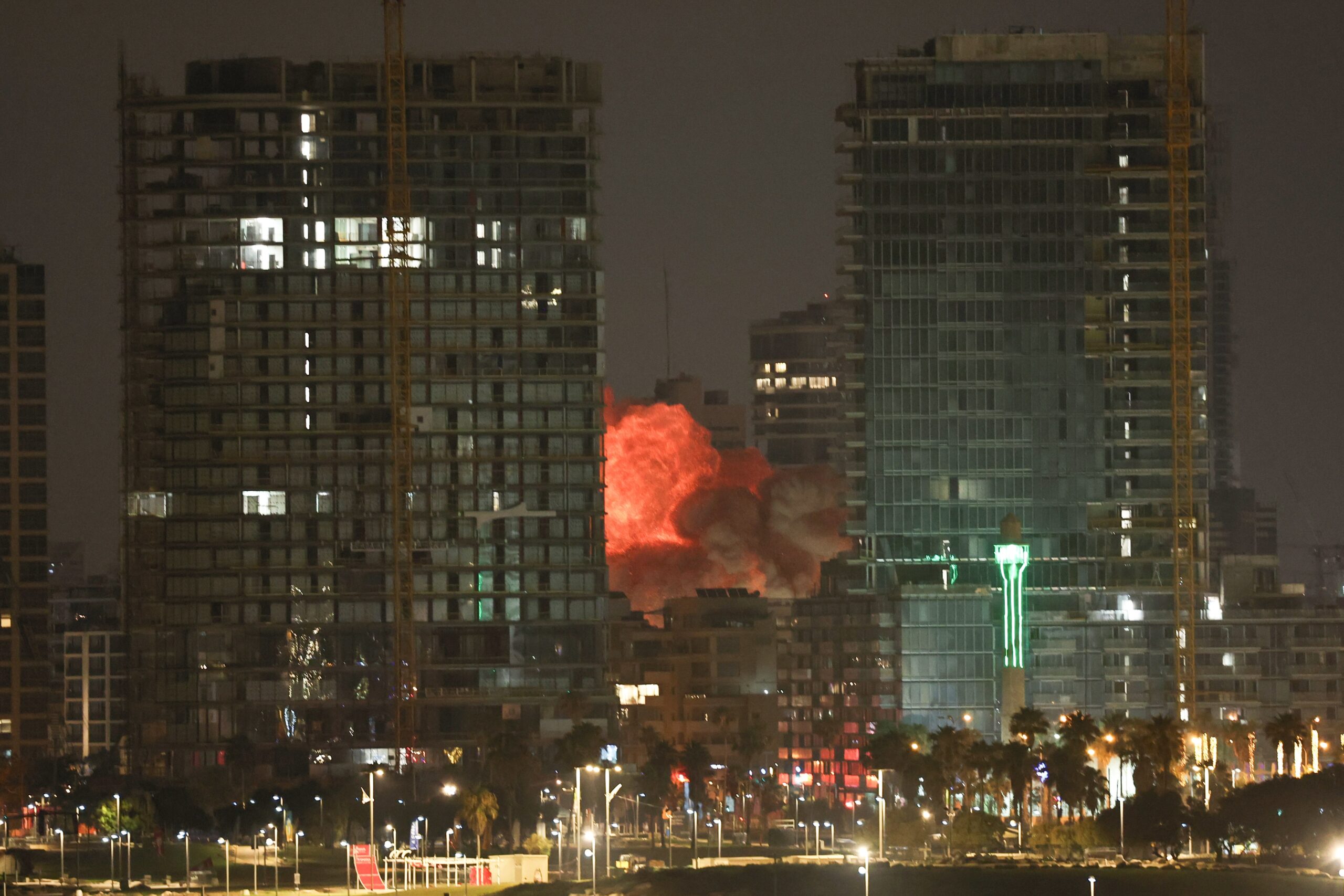 An explosion erupts from a missile fired from Iran in Tel Aviv
