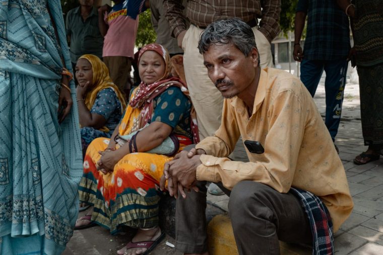 AHMEDABAD, INDIA - JUNE 13: Suresh Patni, 47, father of Akash Patni, who died while resting nearby the Air India Boeing Dreamliner plane crash, mourns and waits outside a hospital to receive updates on his wife's health condition, after she was admitted to hospital with severe burns on June 13, 2025 in Ahmedabad, India. An Air India Boeing 787 Dreamliner, flight AI-171, carrying 242 passengers and crew members en route from Ahmedabad to London Gatwick, crashed shortly after takeoff on June 12, 2025, after the pilot issued a mayday call to air traffic control. The aircraft crashed into the densely populated Meghani Nagar area near Sardar Vallabhbhai Patel International Airport, resulting in a massive explosion and fire due to the heavy fuel load for the international journey, with rescue operations ongoing. (Photo by Elke Scholiers/Getty Images)