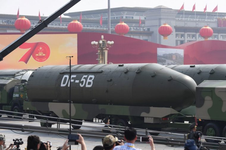Military vehicles carrying DF-5B intercontinental ballistic missiles participate in a military parade at Tiananmen Square in Beijing on October 1, 2019, to mark the 70th anniversary of the founding of the People's Republic of China. (Photo by GREG BAKER / AFP) (Photo by GREG BAKER/AFP via Getty Images)