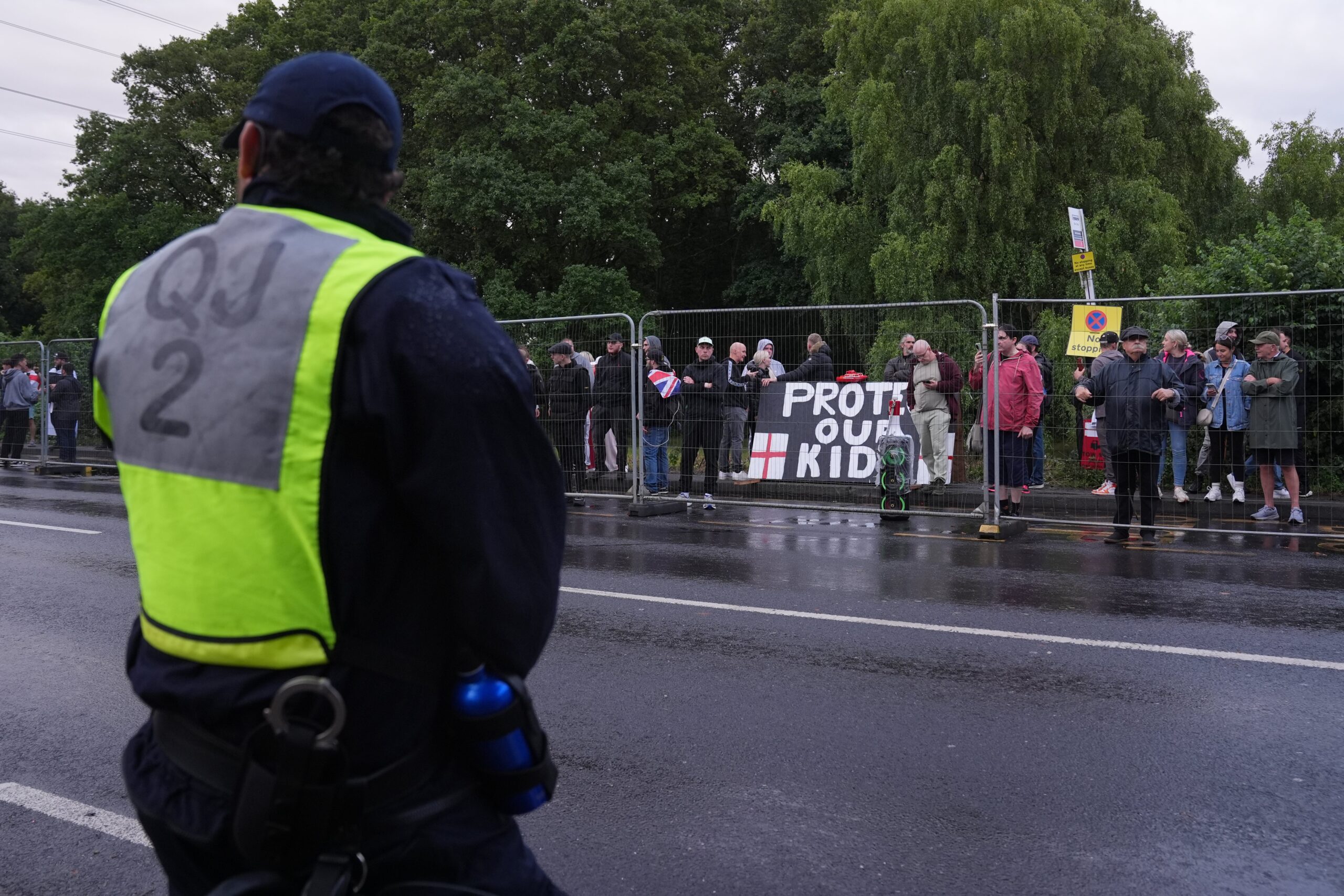 Protesters and police outside the Bell Hotel in Epping, Essex