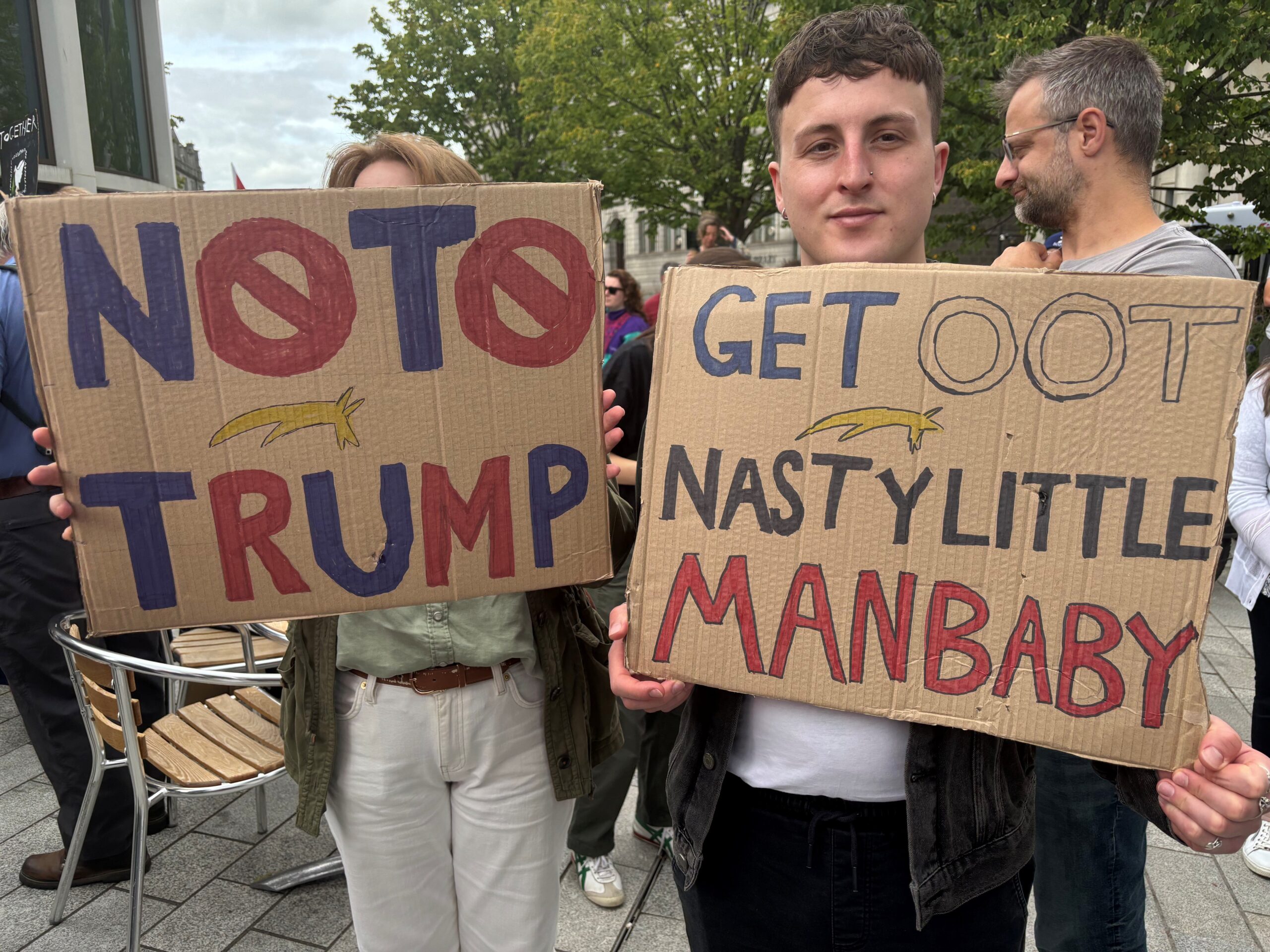 Hundreds of protesters brought anti-Trump signs