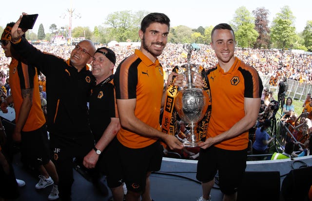 Wolverhampton Wanderers’ Ruben Neves and Diogo Jota (right) pose with the Sky Bet Championship trophy during the winner’s parade through Wolverhampton in 2018