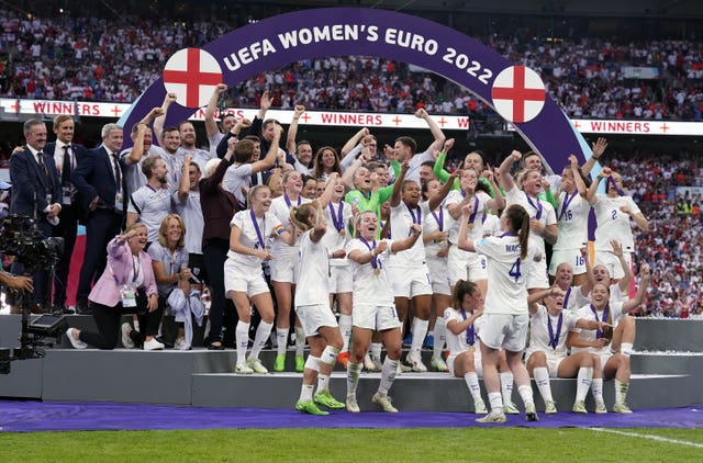 England players celebrate with the trophy following victory over Germany in the Women’s Euro 2022 final at Wembley