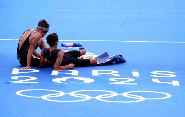 Alex Yee, right, sits with rival Hayden Wilde after their dramatic finish in Paris