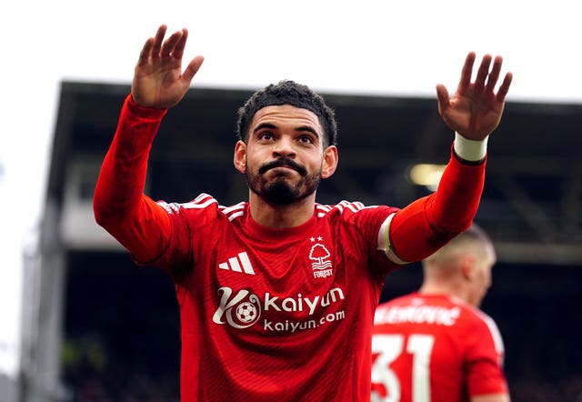 Nottingham Forest's Morgan Gibbs-White raises his arms as he celebrates a goal