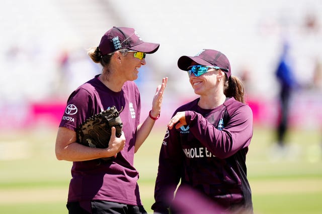 England coach Charlotte Edwards, left, and opening batter Tammy Beaumont share a joke