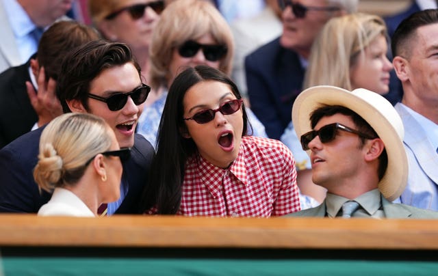 Olivia Rodrigo speaks with Tom Daley in the Royal Box