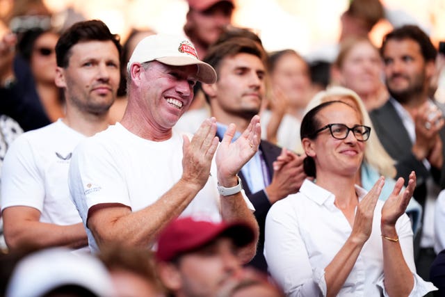 Coach Mark Petchey, left, applauds Emma Raducanu's win over Marketa Vondrousova