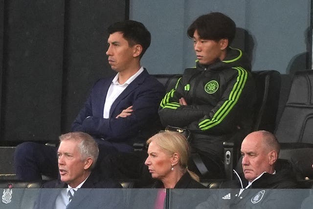 Hayato Inamura (right) watches Queen's Park v Celtic