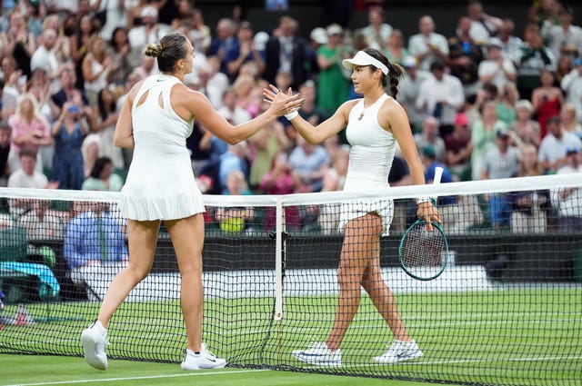 Emma Raducanu, right, shakes hands after losing to Aryna Sabalenka