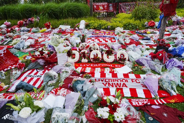 Tributes left at Anfield, home of Liverpool, in memory of Diogo Jota