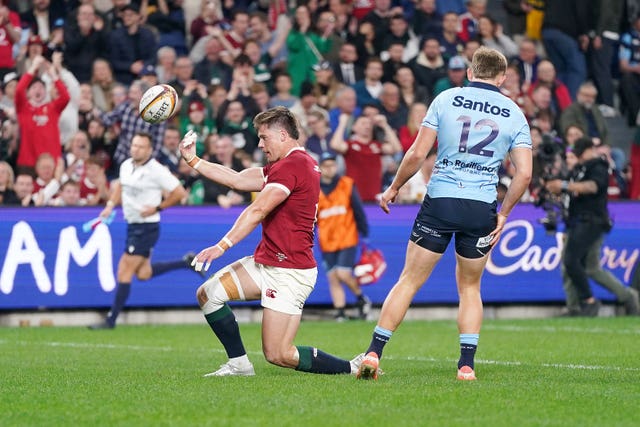 Huw Jones celebrates the opening try