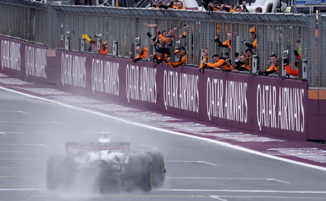 Norris crosses the line