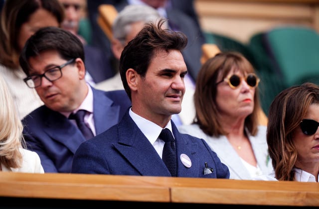 Roger Federer sits in the Royal Box
