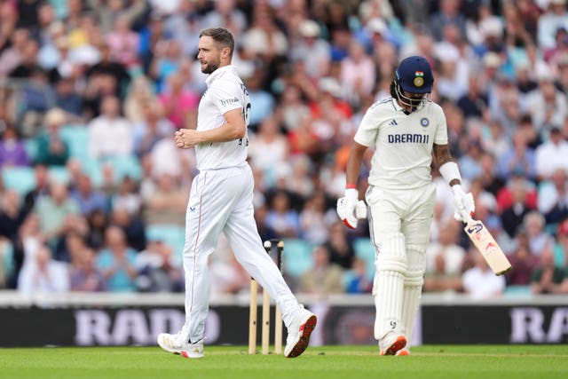 England’s Chris Woakes (left) celebrates bowling out India’s KL Rahul