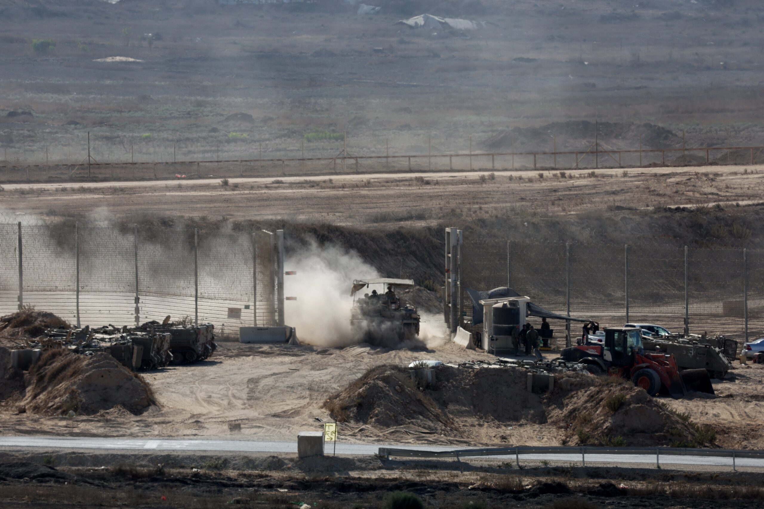 An Israeli APC crosses the Israel-Gaza border and enters Gaza