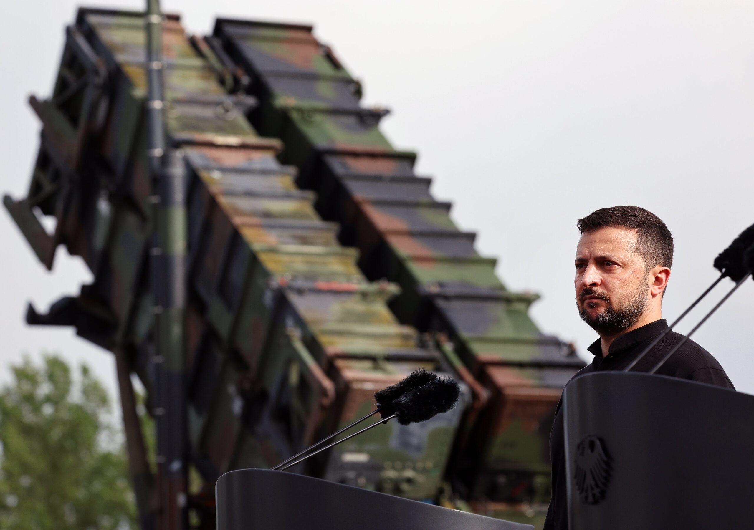 File: Ukrainian president Volodymyr Zelensky stands in front of a Patriot anti-aircraft missile system during his visit to a military training area in Germany