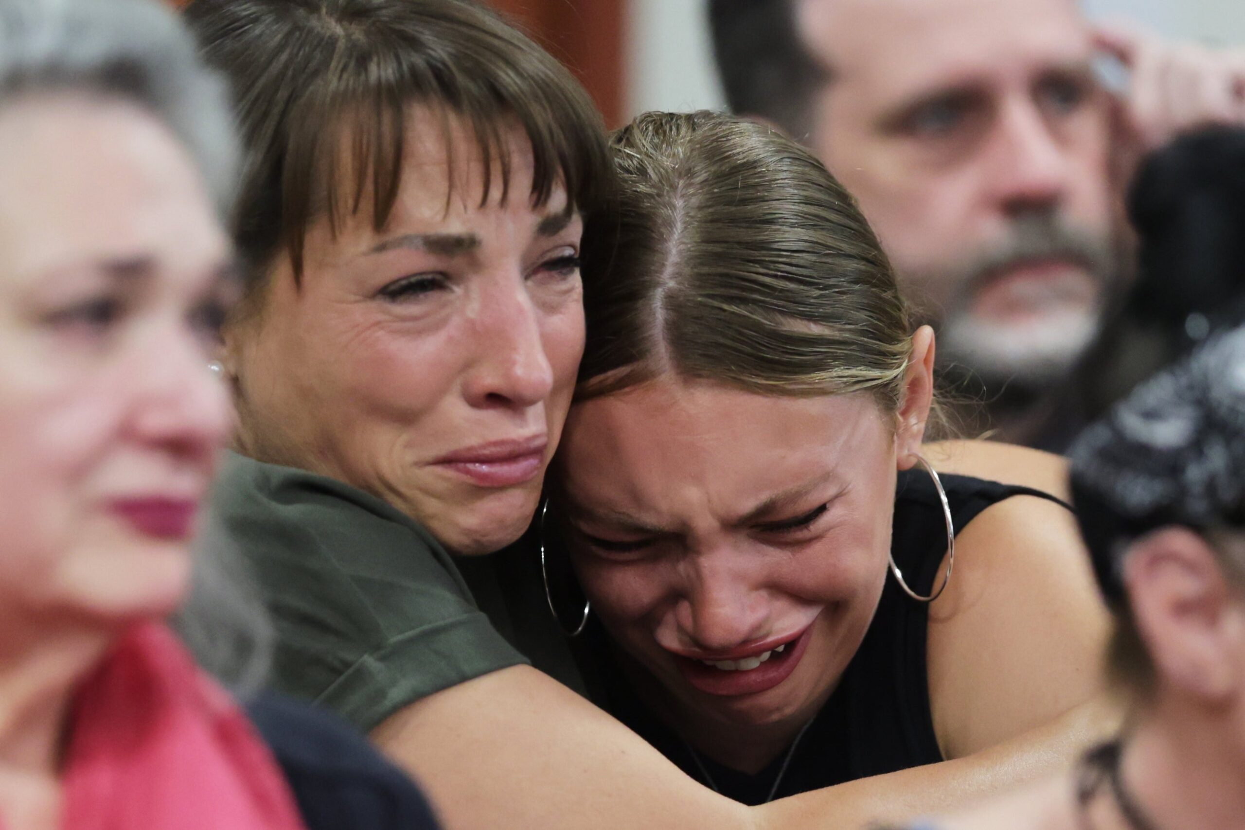 Dylan Mortensen is comforted after speaking at the sentencing hearing of Bryan Kohberger at the Ada County Courthouse on July 23 in Boise, Idaho.