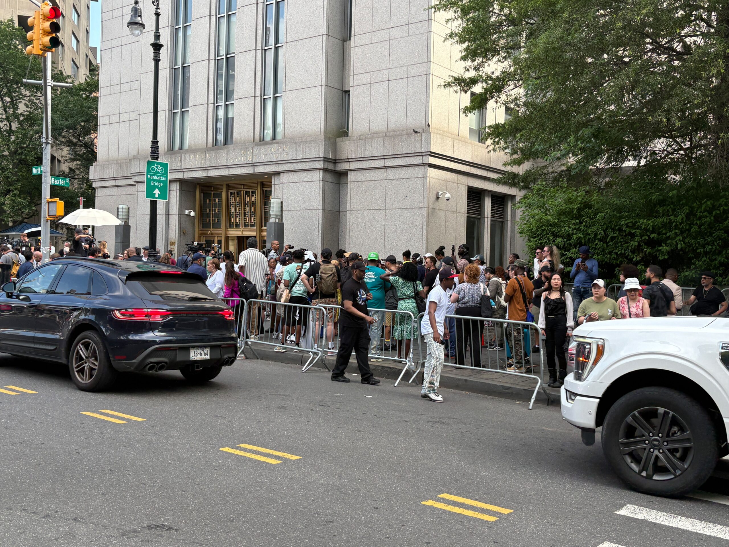 People gather outside the courthouse in New York as Sean “Diddy” Combs learns the verdict inside
