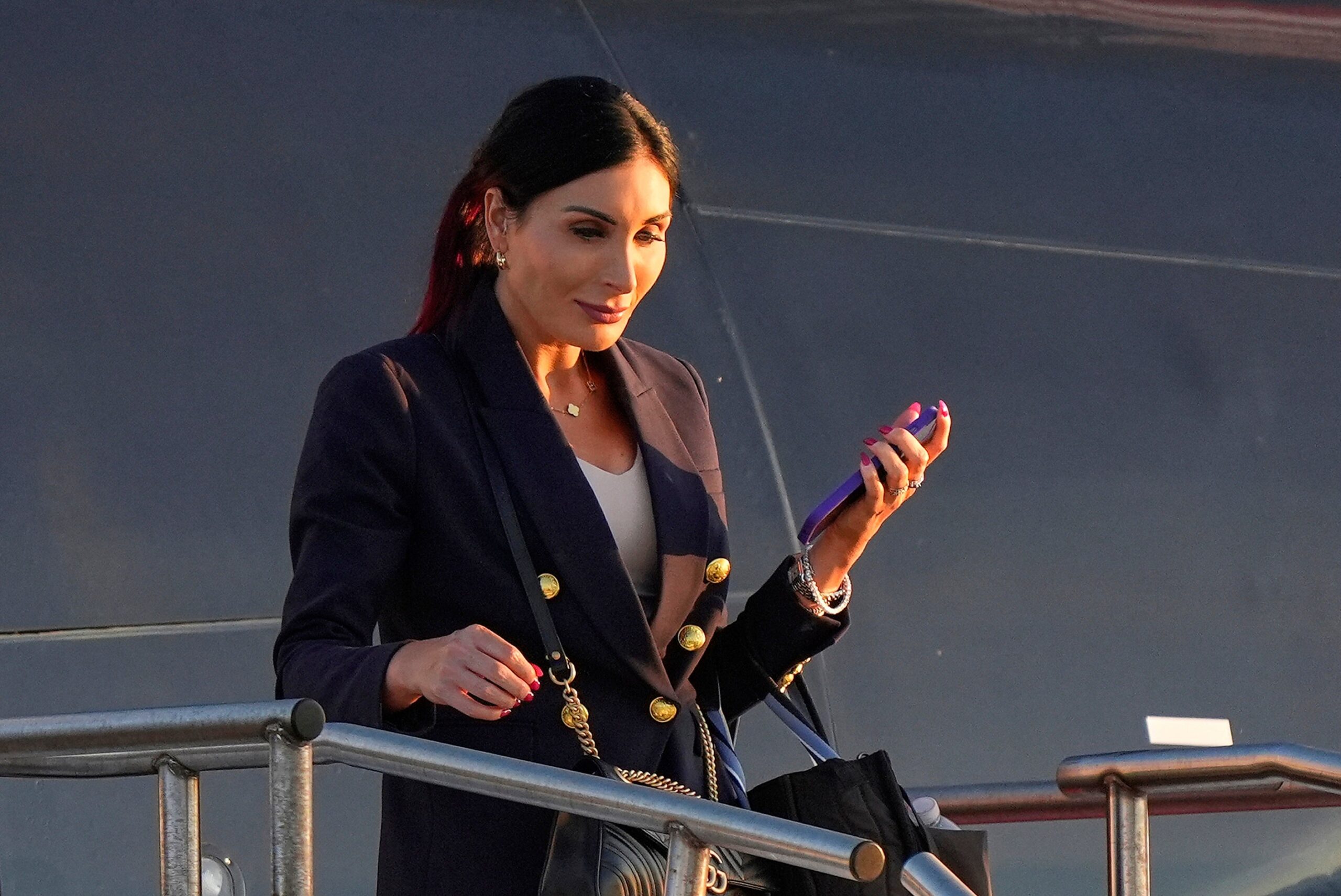 Laura Loomer, shown disembarking from Donald Trump’s jet during the 2024 election, has played a key role in the firings of dozens of administration officials