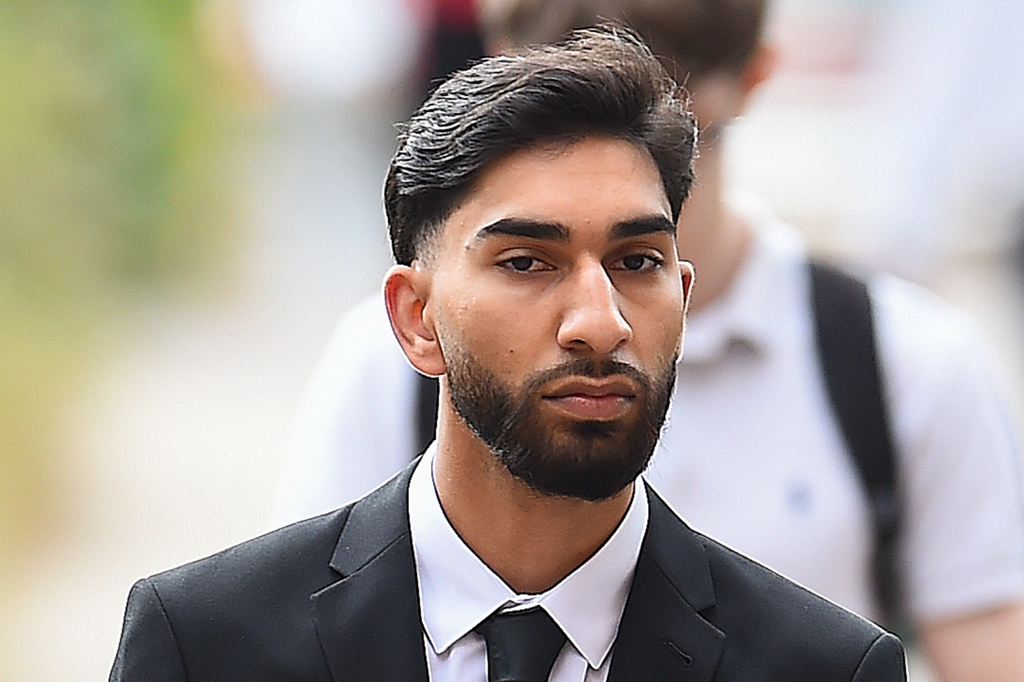 Mohammed Fahir Amaaz arrives at Liverpool Crown Court, where along with Muhammed Amaad they are charged in relation to an altercation with police officers at Manchester Airport's Terminal Two