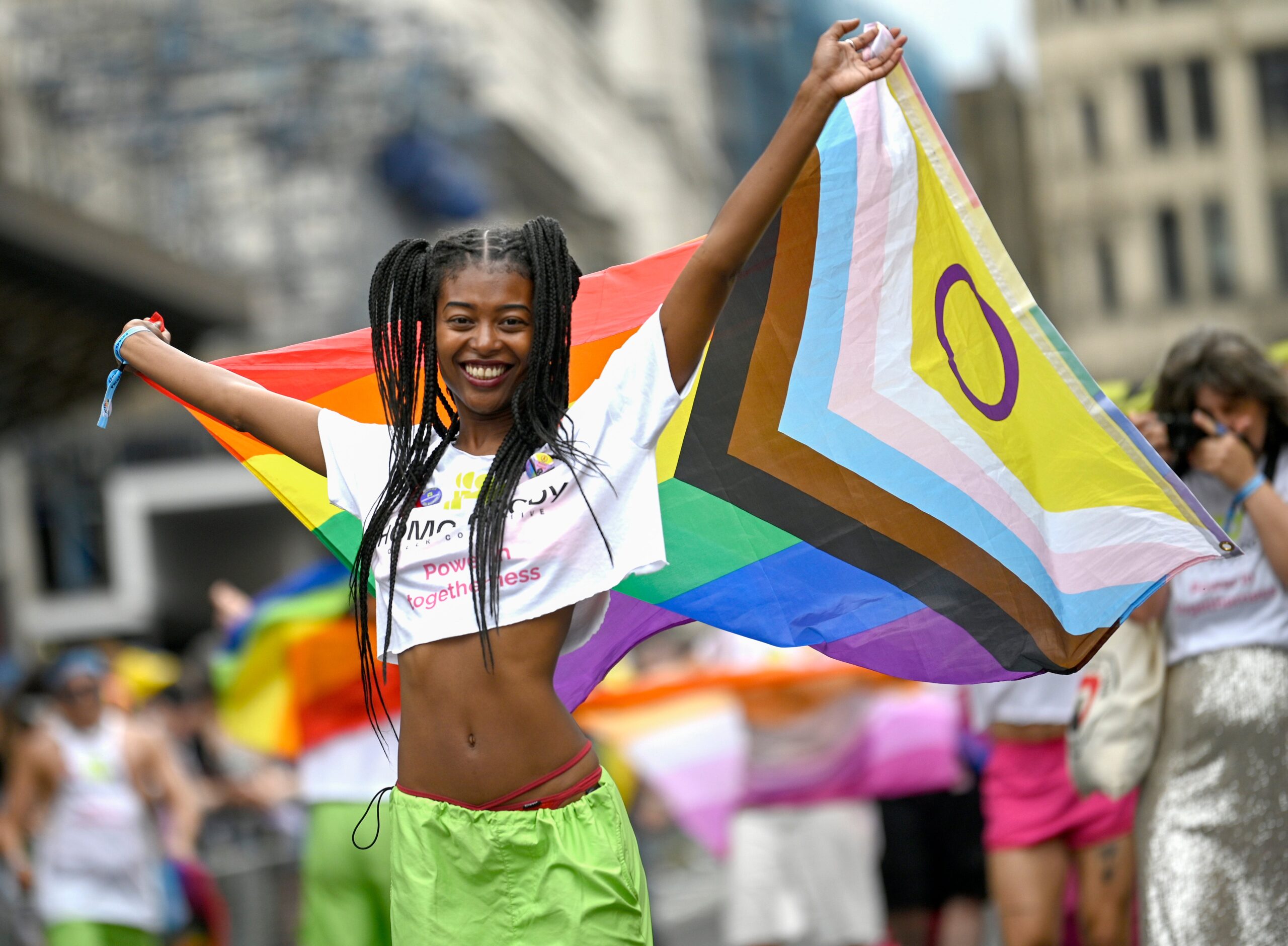 Parade-goer waving flag during the event
