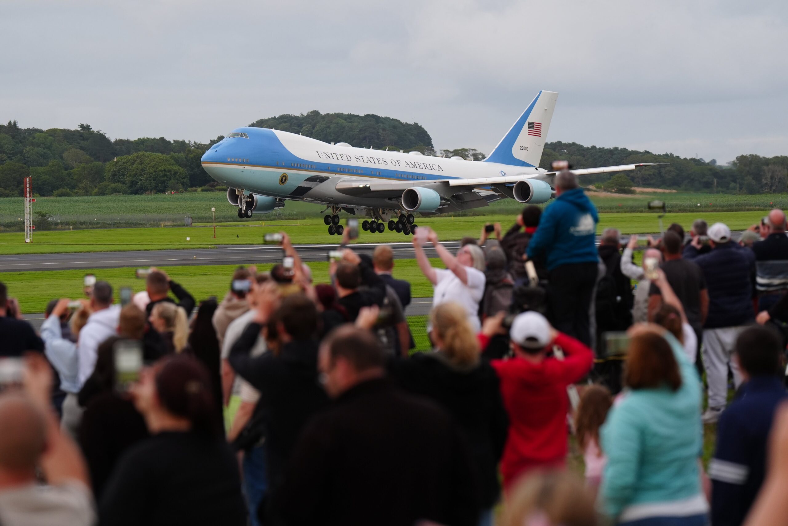 Crowds watch as Donald Trump lands at Prestwick airport as he visits his Turnberry golf course in South Ayrshire