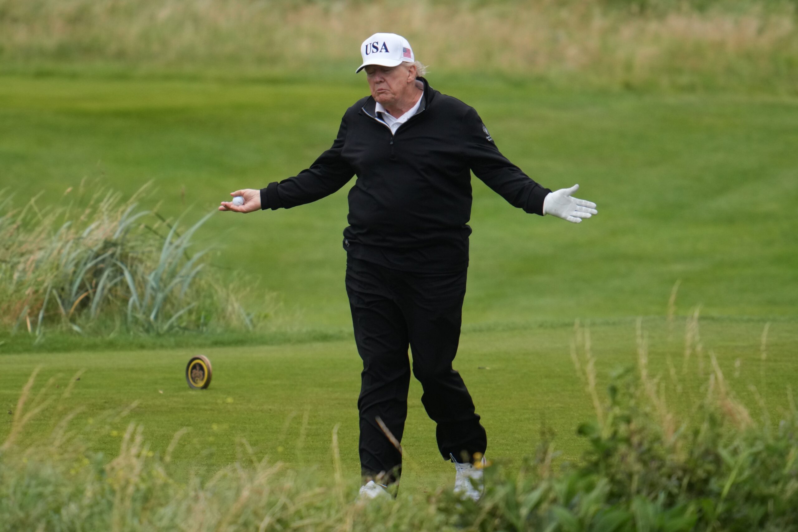 Donald Trump was cheered on by supporters as he arrived at his Turnberry golf resort
