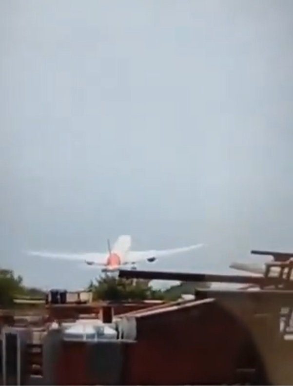 grabs from video showing Air India AI171, a 787-8 Dreamliner, with around 242 passengers on board has reportedly crashed near Ahmedabad airport during take off. Image from Twitter/X Open Source Intel @Osint613