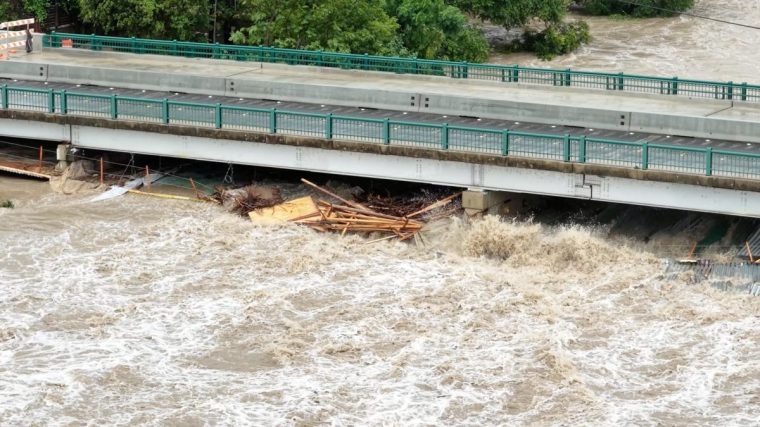 A drone view shows the swollen San Gabriel river, in Georgetown, Texas, U.S. July 5, 2025 in this screen grab from social media video. Adam Grumbo/via REUTERS THIS IMAGE HAS BEEN SUPPLIED BY A THIRD PARTY. MANDATORY CREDIT. NO RESALES. NO ARCHIVES.