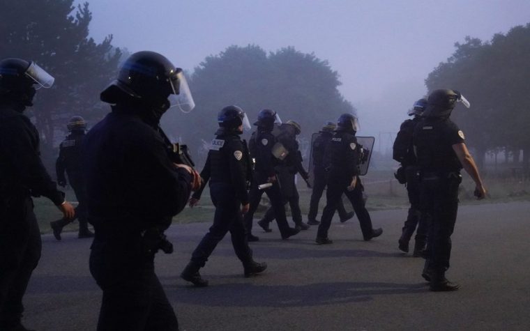 Police officers clash with people thought to be migrants in Gravelines, France, during an attempted small boat crossing to the UK. Picture date: Friday July 18, 2025. PA Photo. Photo credit should read: Gareth Fuller/PA Wire