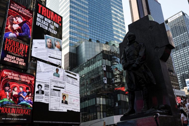 A screen about the Jeffrey Epstein files is displayed at Times Square in New York City, U.S., July 23, 2025. REUTERS/Jeenah Moon