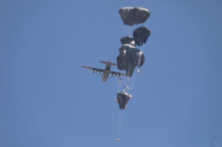 GAZA CITY, GAZA - JULY 27: Airdropped humanitarian aid packages are released from military aircraft over the Zikim area, a kibbutz in southern Israel, as Palestinians continue to suffer from extreme shortages amid ongoing Israeli attacks, in Gaza City, Gaza, on July 27, 2025. (Photo by Mahmoud Issa /Anadolu via Getty Images)