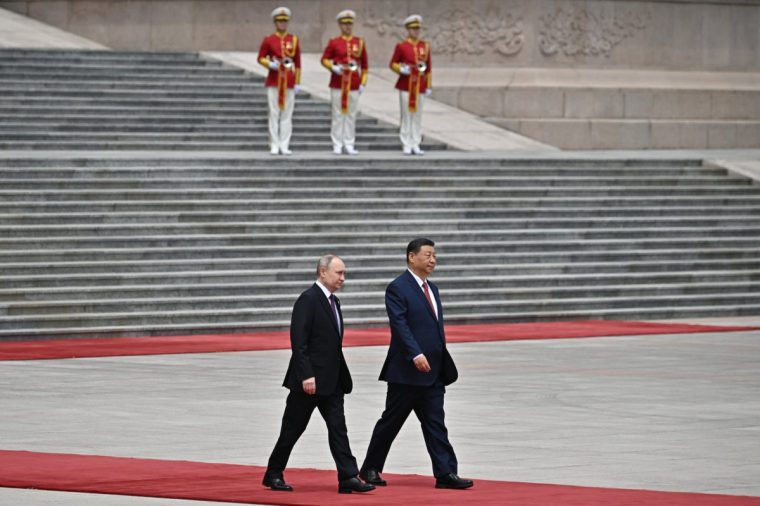 TOPSHOT - In this pool photograph distributed by the Russian state agency Sputnik, Russia's President Vladimir Putin and China's President Xi Jinping attend an official welcoming ceremony in front of the Great Hall of the People in Tiananmen Square in Beijing on May 16, 2024. (Photo by Sergei BOBYLYOV / POOL / AFP) / ** Editor's note : this image is distributed by Russian state owned agency Sputnik ** (Photo by SERGEI BOBYLYOV/POOL/AFP via Getty Images)