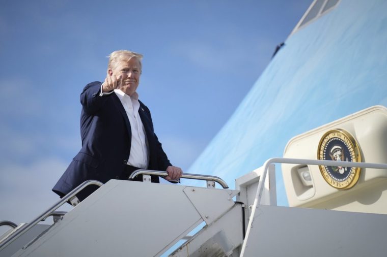 President Donald Trump gestures as he boards Air Force One, Tuesday, July 29, 2025, at Royal Air Force Lossiemouth en route to return to Washington. (AP Photo/Jacquelyn Martin)
