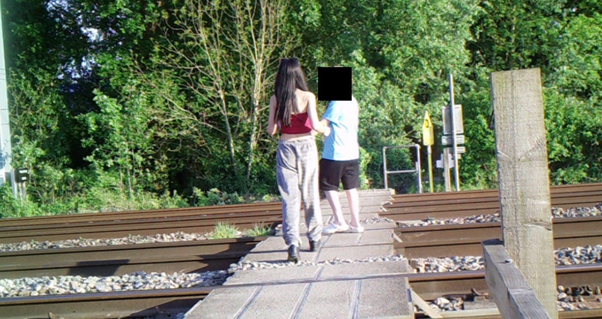 Footage shows children filming and photographing themselves in the middle of the track