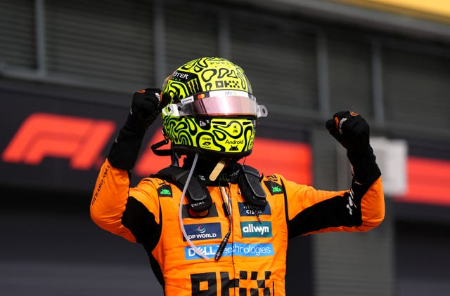 Norris celebrates his victory at the Hungaroring