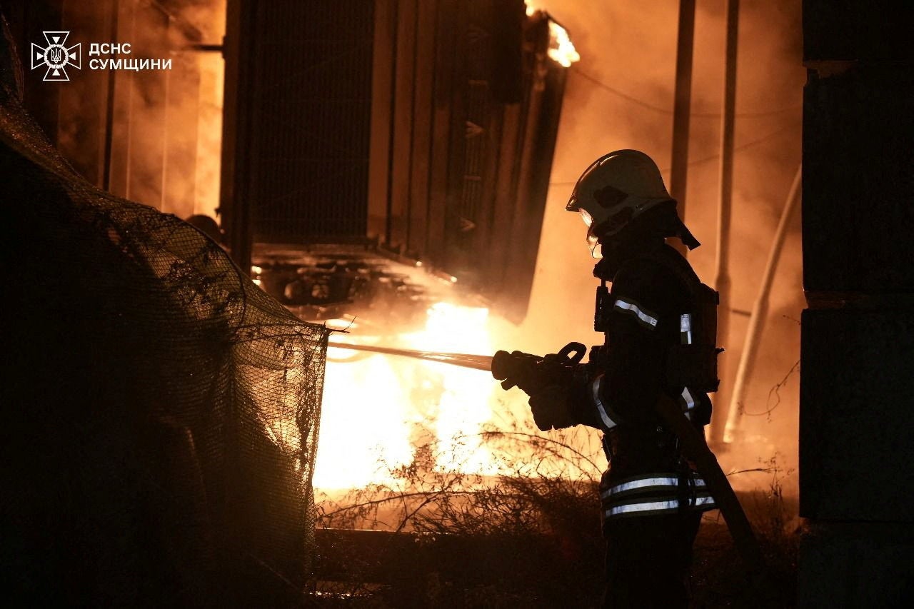 A firefighter works at the site of the Russian drone strike