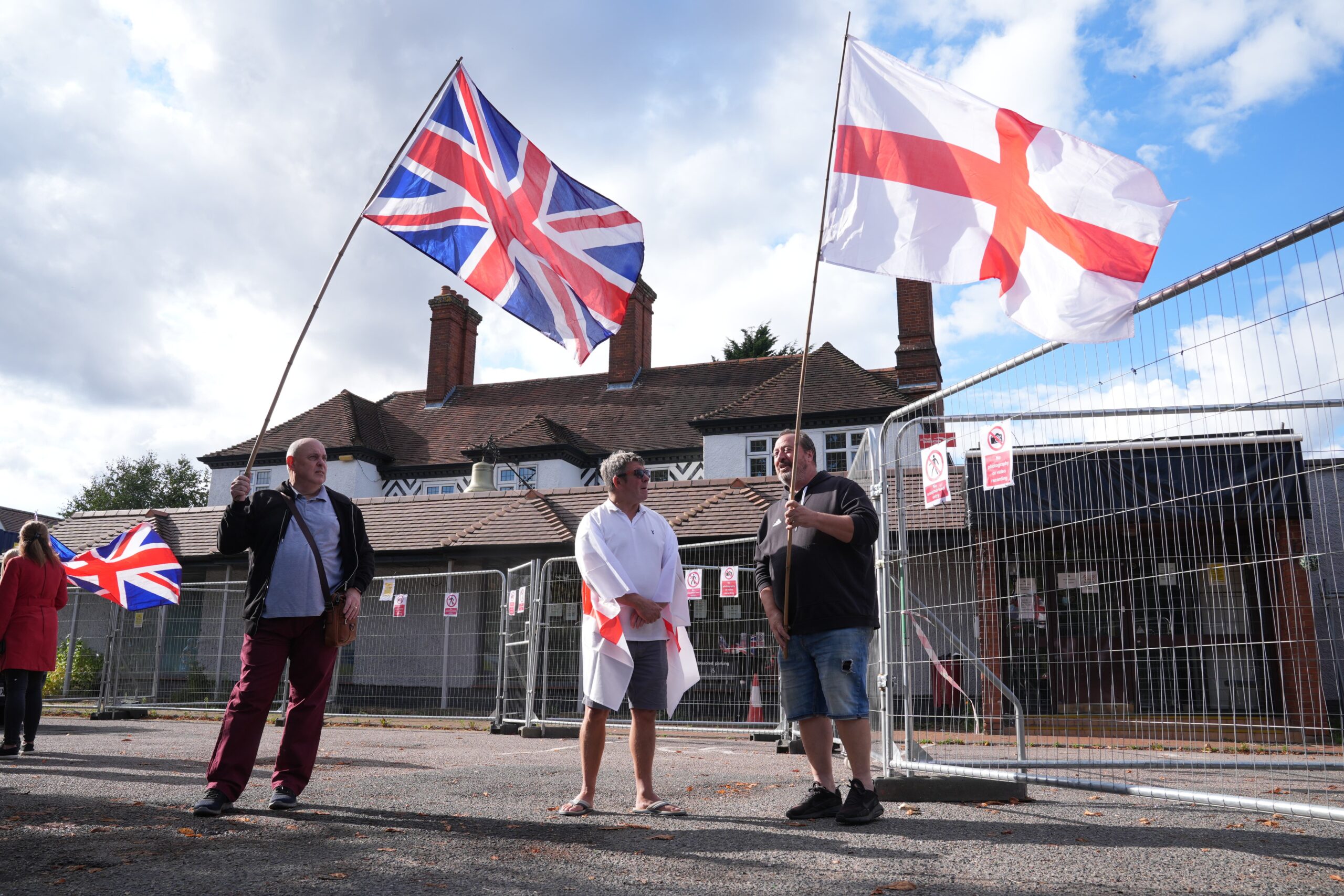Protesters outside the Bell Hotel after a temporary injunction that would have blocked asylum seekers from being housed at the hotel in Epping, Essex, was overturned at the Court of Appeal