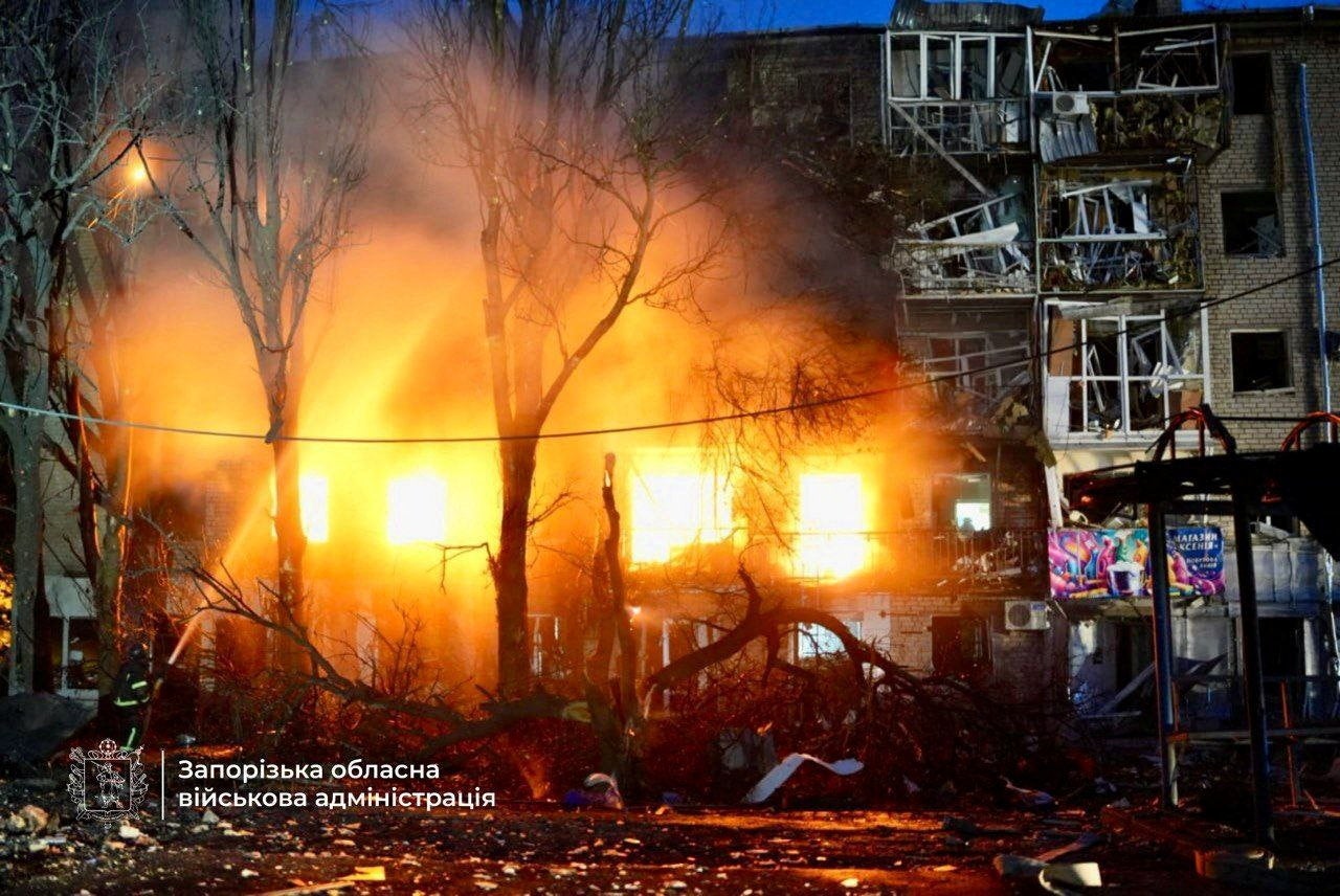 Firefighters work at the site of an apartment building hit during a Russian drone and missile strike, amid Russia's attack on Ukraine, in Zaporizhzhia