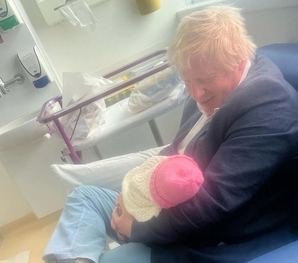 Mr Johnson pictured with his newborn baby daughter Poppy in May
