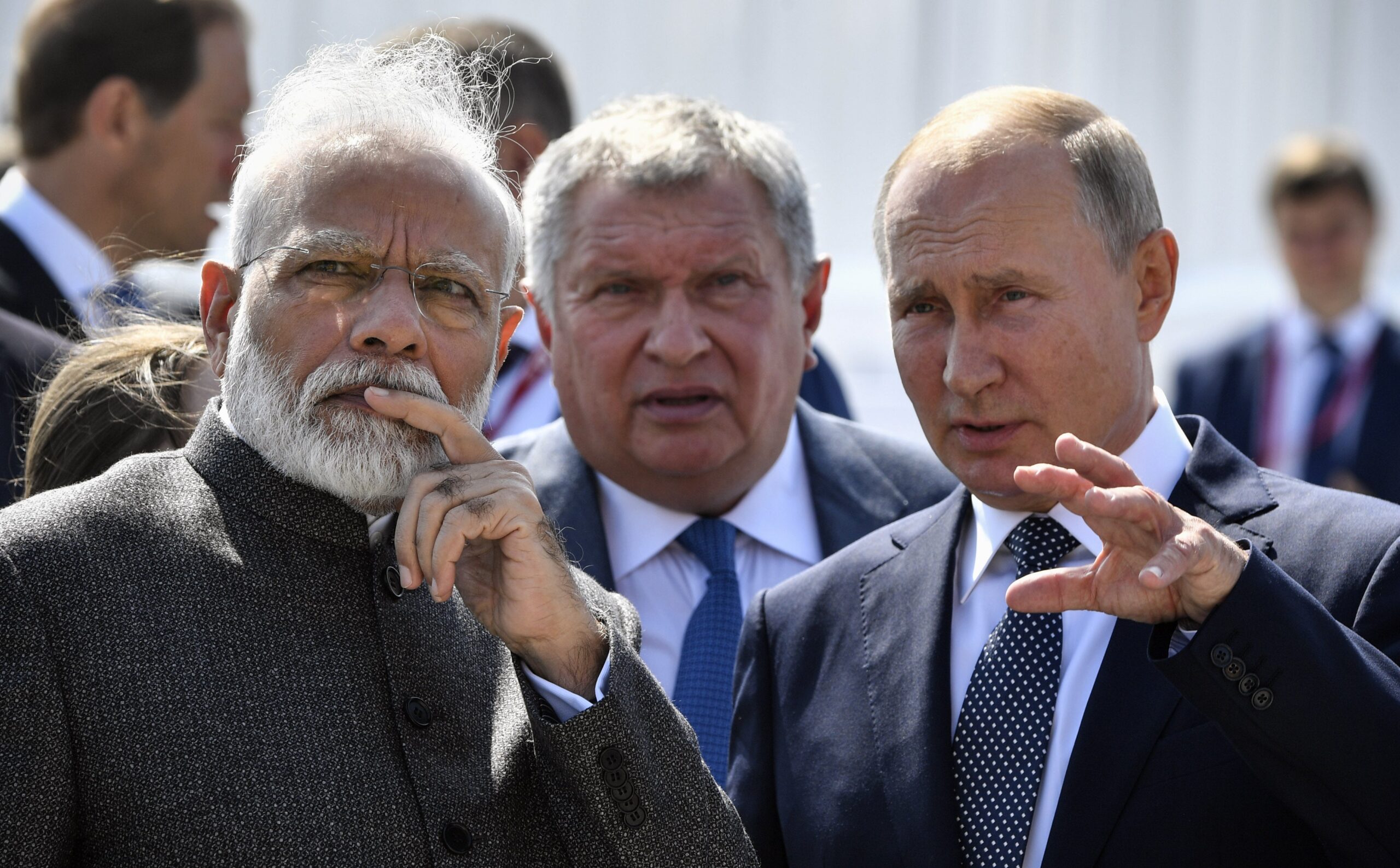Russia's president Vladimir Putin speaks with India's prime minister Narendra Modi during a visit to the shipyard Zvezda, as Rosneft Russian oil giant chief Igor Sechin accompanies them, outside the far-eastern Russian port of Vladivostok
